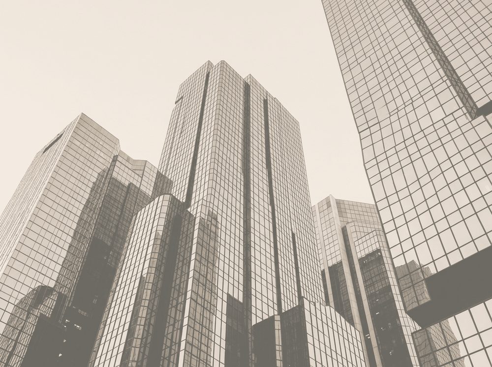 Duotone photograph of a glass financial skyline for Chase