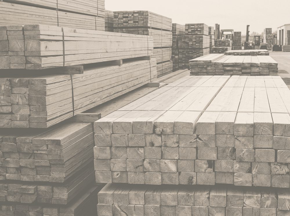 Duotone photograph of stacked timber lumber for Home Depot